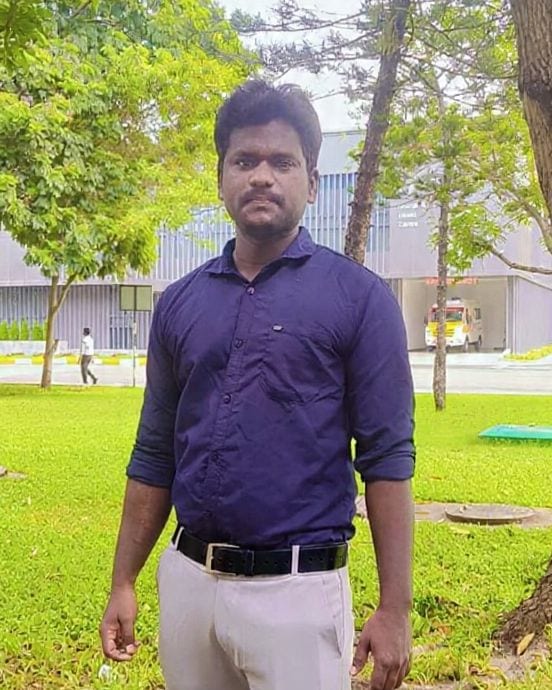 M. Vinothkumar standing outdoors on a green campus