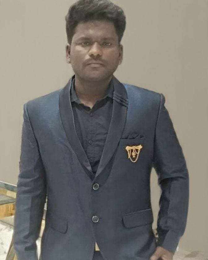 M. Vinothkumar, founder of V-BOSS Camphor, in a navy blazer