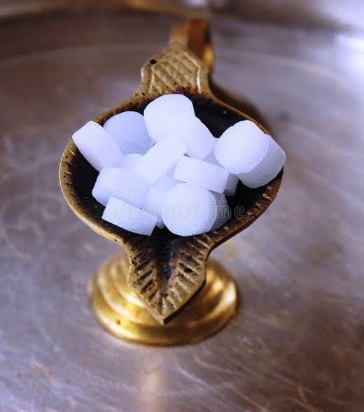 V-BOSS camphor tablets heaped in a traditional brass aarti lamp