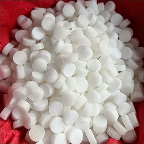 A large heap of uniform V-BOSS camphor tablets on red cloth